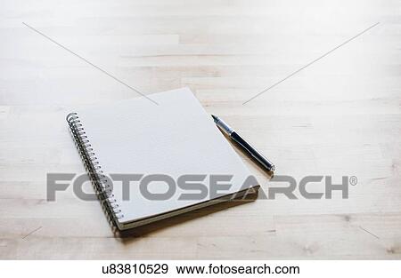 Studio shot of spiral notebook and ballpoint pen View Large Photo Image Stock Photo - Studio shot of spiral notebook and ballpoint pen. Fotosearch