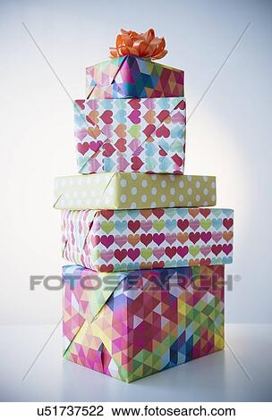 Stock Image - Studio Shot of stack of colorful presents. Fotosearch