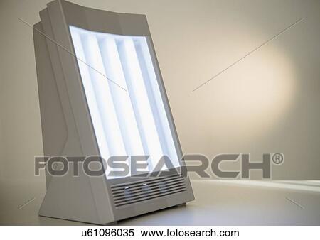 Stock Photography - Studio Shot of sun lamp on white background. Fotosearch