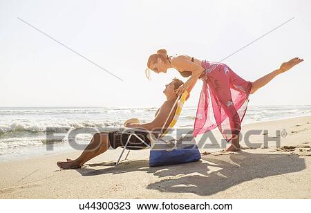 View of couple on beach View Large Photo Image Stock Image - View of couple on beach. Fotosearch