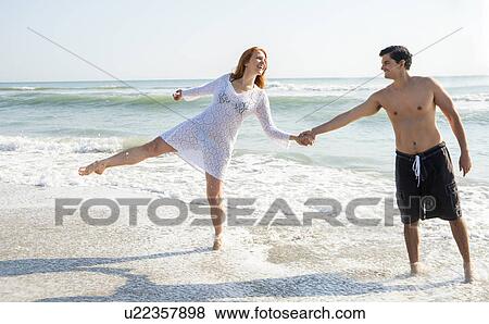 View of couple on beach View Large Photo Image Stock Photo - View of couple on beach. Fotosearch