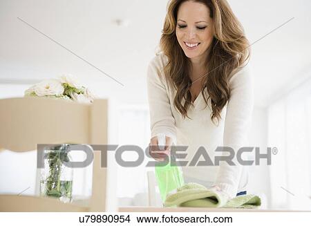 Picture - Woman cleaning at home. Fotosearch