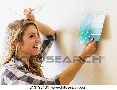 Woman holding color swatch View Large Photo Image Stock Image - Woman holding color swatch. Fotosearch