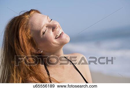 Woman on beach suntanning View Large Photo Image Stock Photo - Woman on beach suntanning. Fotosearch