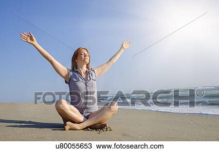 Woman practicing yoga on beach View Large Photo Image Stock Image - Woman practicing yoga on beach. Fotosearch