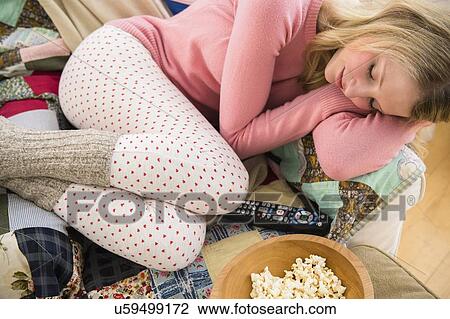 Woman sleeping on sofa View Large Photo Image Stock Image - Woman sleeping on sofa. Fotosearch