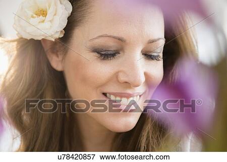 Stock Photo - Woman wearing flower. Fotosearch
