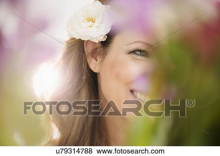 Woman wearing flower View Large Photo Image Stock Photo - Woman wearing flower. Fotosearch