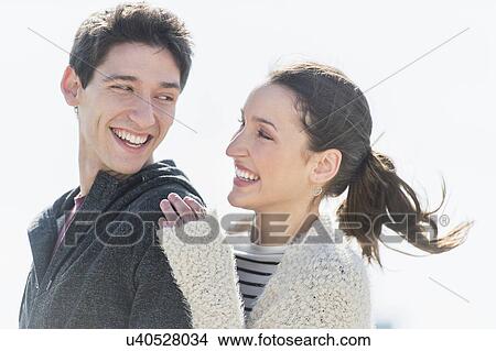 Picture - Young couple laughing. Fotosearch