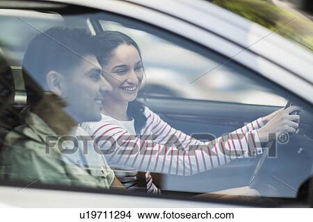 Young couple traveling in car View Large Photo Image Picture - Young couple traveling in car. Fotosearch