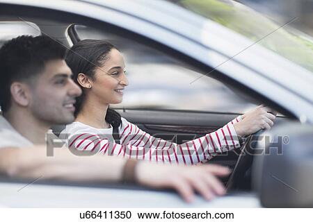 Young couple traveling in car View Large Photo Image Stock Image - Young couple traveling in car. Fotosearch