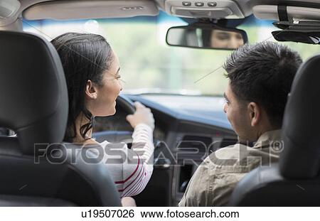 Young couple traveling in car View Large Photo Image Stock Photograph - Young couple traveling in car. Fotosearch