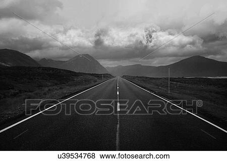 Black and white image of straight road and mountains, Scottish Highlands, Scotland View Large Photo Image Stock Photo - Black and white image of straight road and mountains, Scottish Highlands, Scotland. Fotosearch