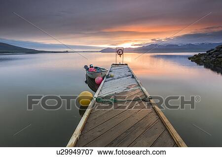 Boat and pier at sunset, Hvalfjordur, Iceland View Large Photo Image Stock Photo - Boat and pier at sunset, Hvalfjordur, Iceland. Fotosearch