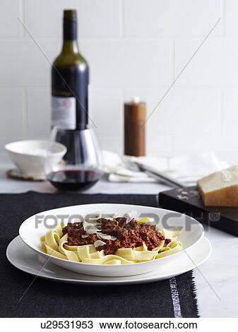 Bolognese ragu with tagliatelle and red wine View Large Photo Image Stock Image - Bolognese ragu with tagliatelle and red wine. Fotosearch