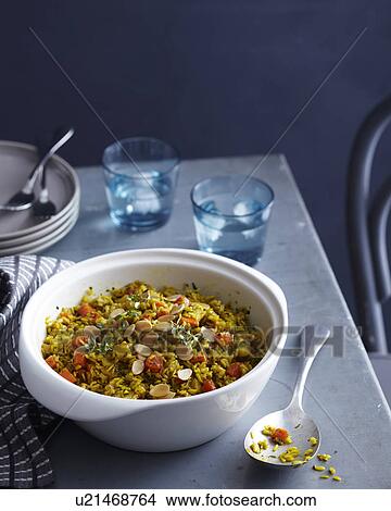 Bowl of spiced brown rice pilaf with herb garnish View Large Photo Image Picture - Bowl of spiced brown rice pilaf with herb garnish. Fotosearch