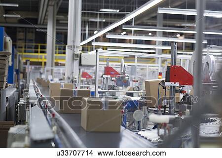 Picture - Boxes on production line at paper packaging factory. Fotosearch