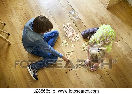 Brother and sister counting coins from savings jar View Large Photo Image Stock Photography - Brother and sister counting coins from savings jar. Fotosearch