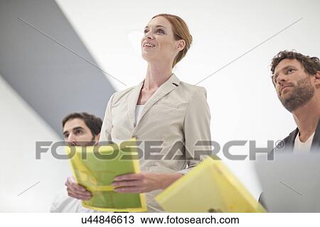 Business colleagues in meeting View Large Photo Image Stock Image - Business colleagues in meeting. Fotosearch