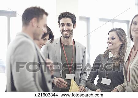 Businesswomen and businessmen in conference centre atrium View Large Photo Image Picture - Businesswomen and businessmen in conference centre atrium. Fotosearch