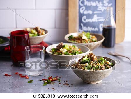 Cafe counter with bowls of fried rice with sausage and egg View Large Photo Image Stock Photo - Cafe counter with bowls of fried rice with sausage and egg. Fotosearch
