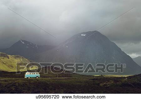 Stock Image - Campervan on the road in Scottish Highlands, Scotland. Fotosearch