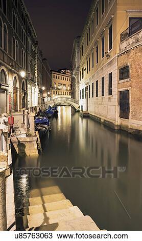 Stock Image - Canal steps at night, Venice, Veneto, Italy. Fotosearch