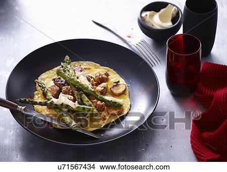 Picture - Chargrilled asparagus omelette served on a plate. Fotosearch
