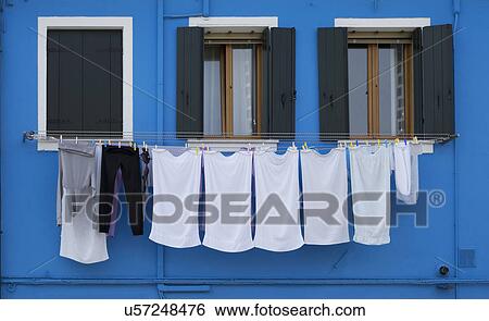 Close up of laundry and blue painted house, Burano, Venice, Veneto, Italy View Large Photo Image Stock Photograph - Close up of laundry and blue painted house, Burano, Venice, Veneto, Italy. Fotosearch