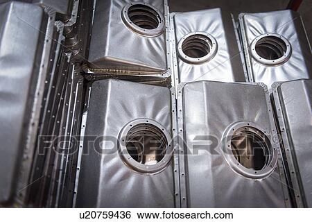 Close up of pressed parts in sheet metal factory View Large Photo Image Stock Photograph - Close up of pressed parts in sheet metal factory. Fotosearch