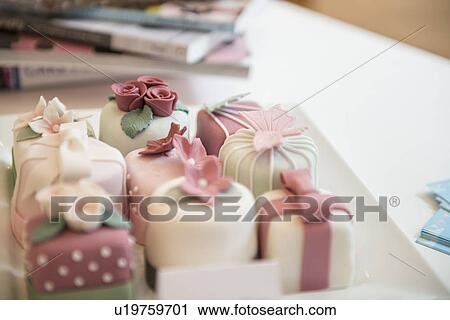 Close up of variety of individual decorated cakes in bakery View Large Photo Image Stock Image - Close up of variety of individual decorated cakes in bakery. Fotosearch