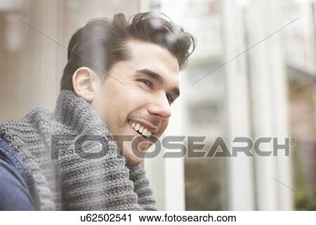 Stock Image - Close up portrait of smiling young man. Fotosearch