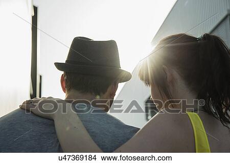 Close up rear view of young couple in street View Large Photo Image Picture - Close up rear view of young couple in street. Fotosearch