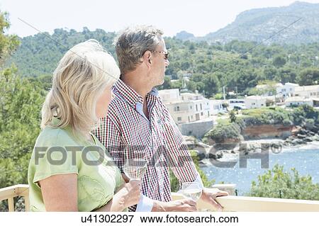 Couple celebrating on holiday, Mallorca, Spain View Large Photo Image Stock Photo - Couple celebrating on holiday, Mallorca, Spain. Fotosearch