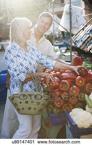 Couple choosing capsicum at market, Mallorca, Spain View Large Photo Image Stock Image - Couple choosing capsicum at market, Mallorca, Spain. Fotosearch