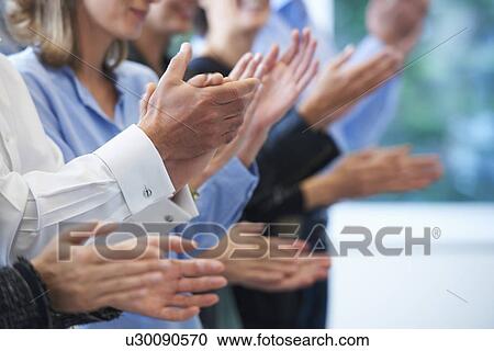 Stock Image - Cropped image of hands clapping. Fotosearch