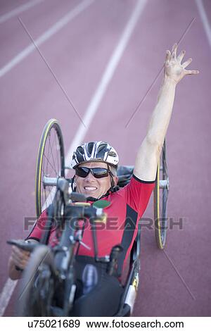 Cyclist at finishing line in para-athletic competition View Large Photo Image Stock Photo - Cyclist at finishing line in para-athletic competition. Fotosearch