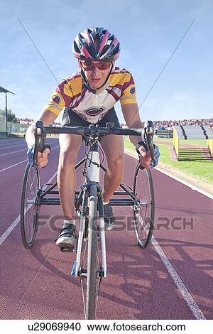Stock Image - Cyclist at start line in para-athletic competition. Fotosearch