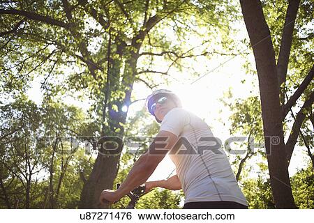 Cyclist in forest View Large Photo Image Stock Photograph - Cyclist in forest. Fotosearch