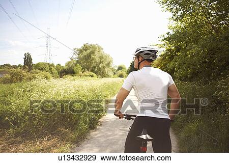 Cyclist stopping for break View Large Photo Image Stock Photo - Cyclist stopping for break. Fotosearch
