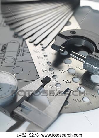 Engineering design - micrometer, screw gauge and feeler gauge on blueprint View Large Photo Image Stock Image - Engineering design - micrometer, screw gauge and feeler gauge on blueprint. Fotosearch
