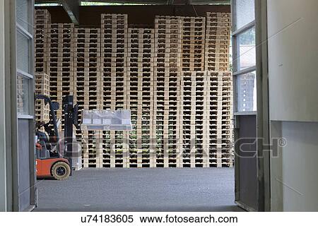 Factory worker using forklift truck View Large Photo Image Stock Photography - Factory worker using forklift truck. Fotosearch