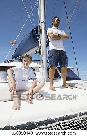 Father and son sailing catamaran off Fuerteventura, Spain View Large Photo Image Stock Image - Father and son sailing catamaran off Fuerteventura, Spain. Fotosearch