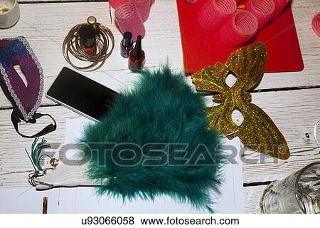 Feather fan, party mask, hair rollers, nail varnish, smartphone View Large Photo Image Stock Photo - Feather fan, party mask, hair rollers, nail varnish, smartphone. Fotosearch