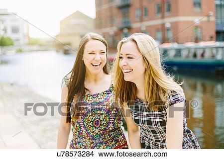 Picture - Female friends laughing. Fotosearch