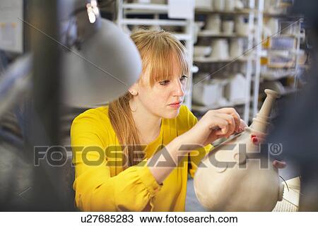 Female potter working in ceramic workshop View Large Photo Image Stock Image - Female potter working in ceramic workshop. Fotosearch