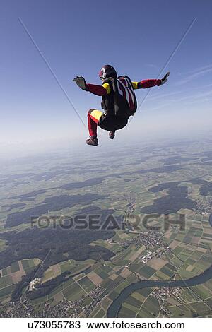 Female skydiver free falling over Grenchen, Berne, Switzerland View Large Photo Image Stock Image - Female skydiver free falling over Grenchen, Berne, Switzerland. Fotosearch