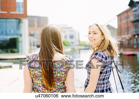 Friends by canal, Leeds, England View Large Photo Image Stock Photograph - Friends by canal, Leeds, England. Fotosearch
