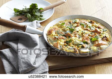 Frying pan with salmon and chickpea frittata and fresh herbs View Large Photo Image Stock Image - Frying pan with salmon and chickpea frittata and fresh herbs. Fotosearch