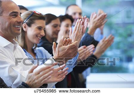 Stock Photography - Group of people clapping. Fotosearch